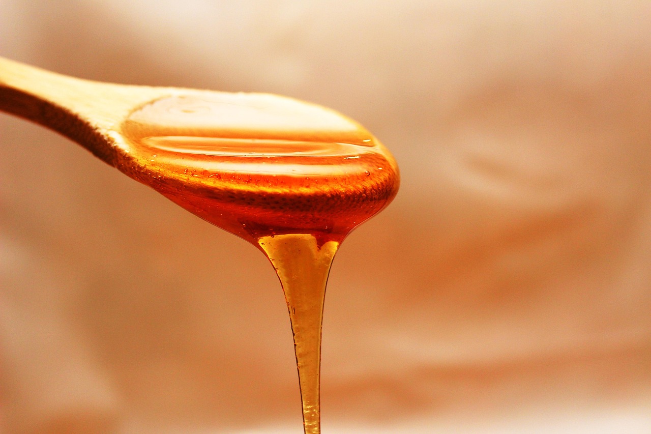 Honey, flowing, spoon — Embracing Wellness: The Stuart Piltch Resilient Health Approach